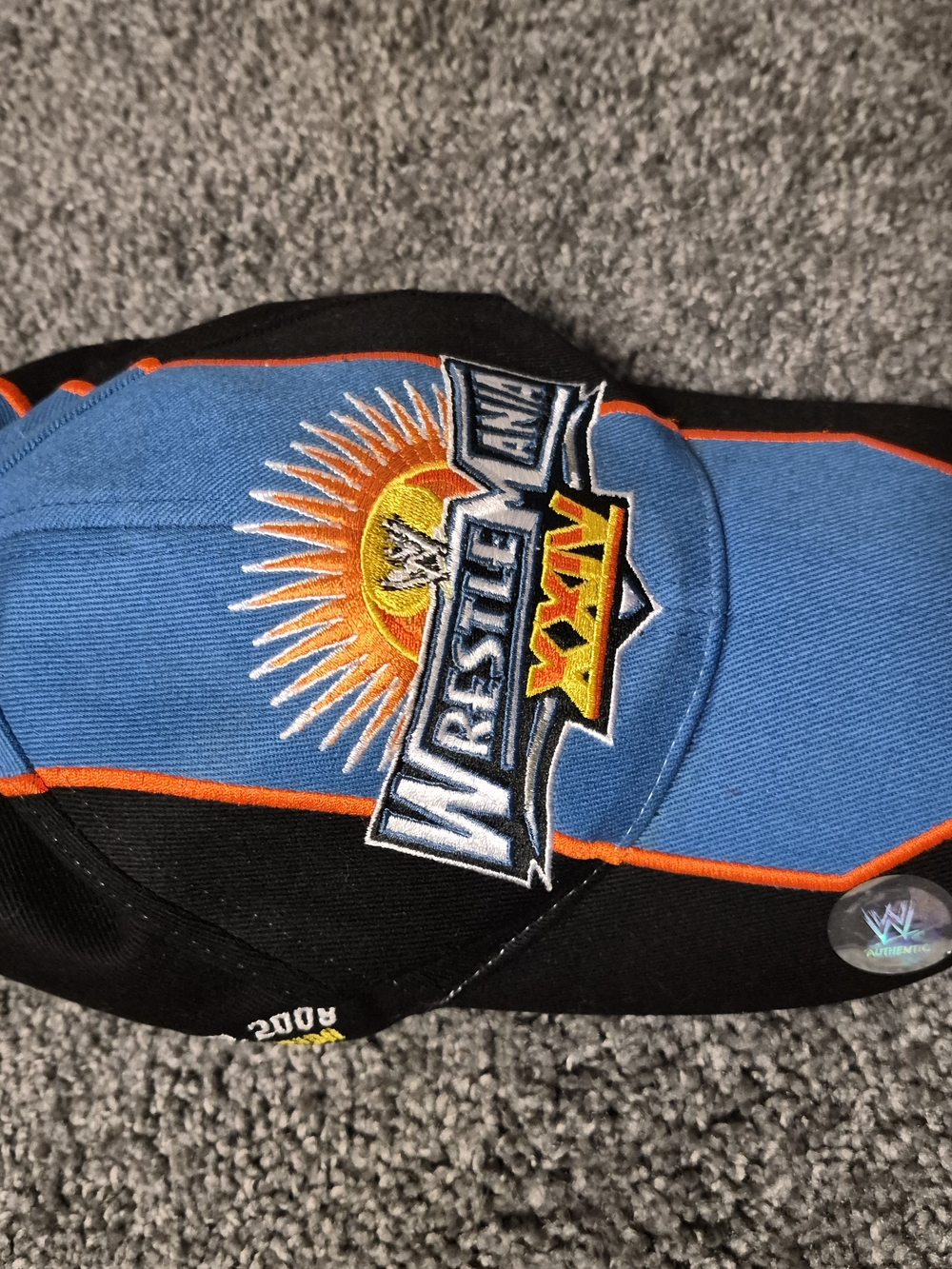 WWE WrestleMania XXV Blue & Black Cap with Orange Trim
